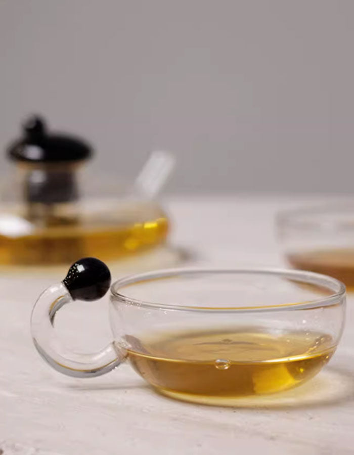 RSTEA: A Set Of Glass Teapot And Cup