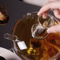 RSTEA: A Set Of Glass Teapot And Cup
